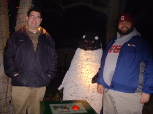 Josh and Jordan in front of a kind of creepy talking penguin