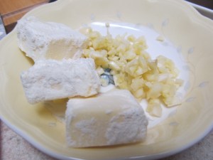 This picture shows both the butter that has been rolled in flour and the minced garlic
